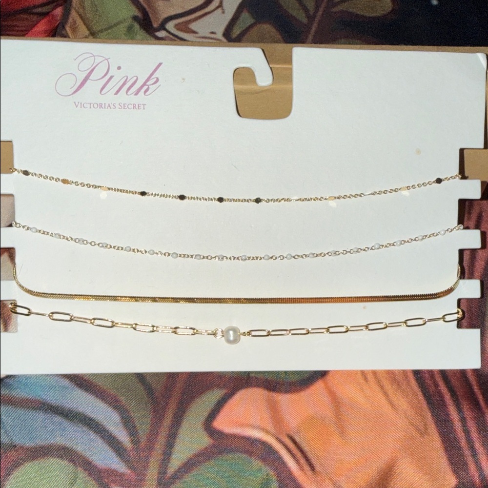 BRAND NEW- Victoria's Secret Gold Tone Layering Necklaces Set. 4 STUNNING chains